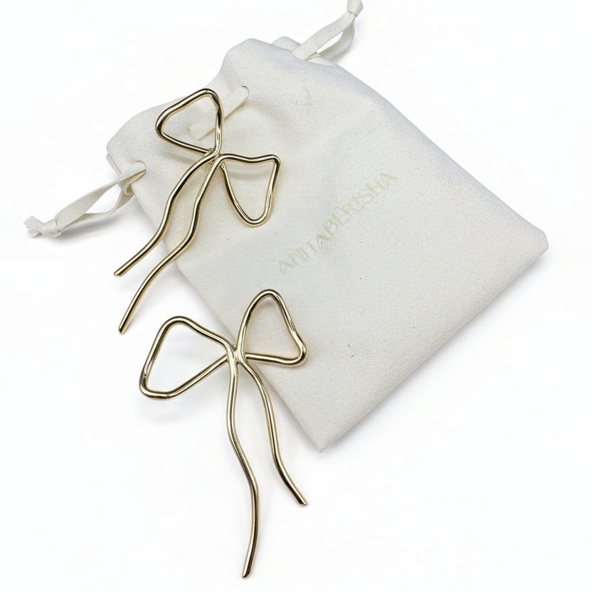 Anita Berisha gold tone statement bow earrings