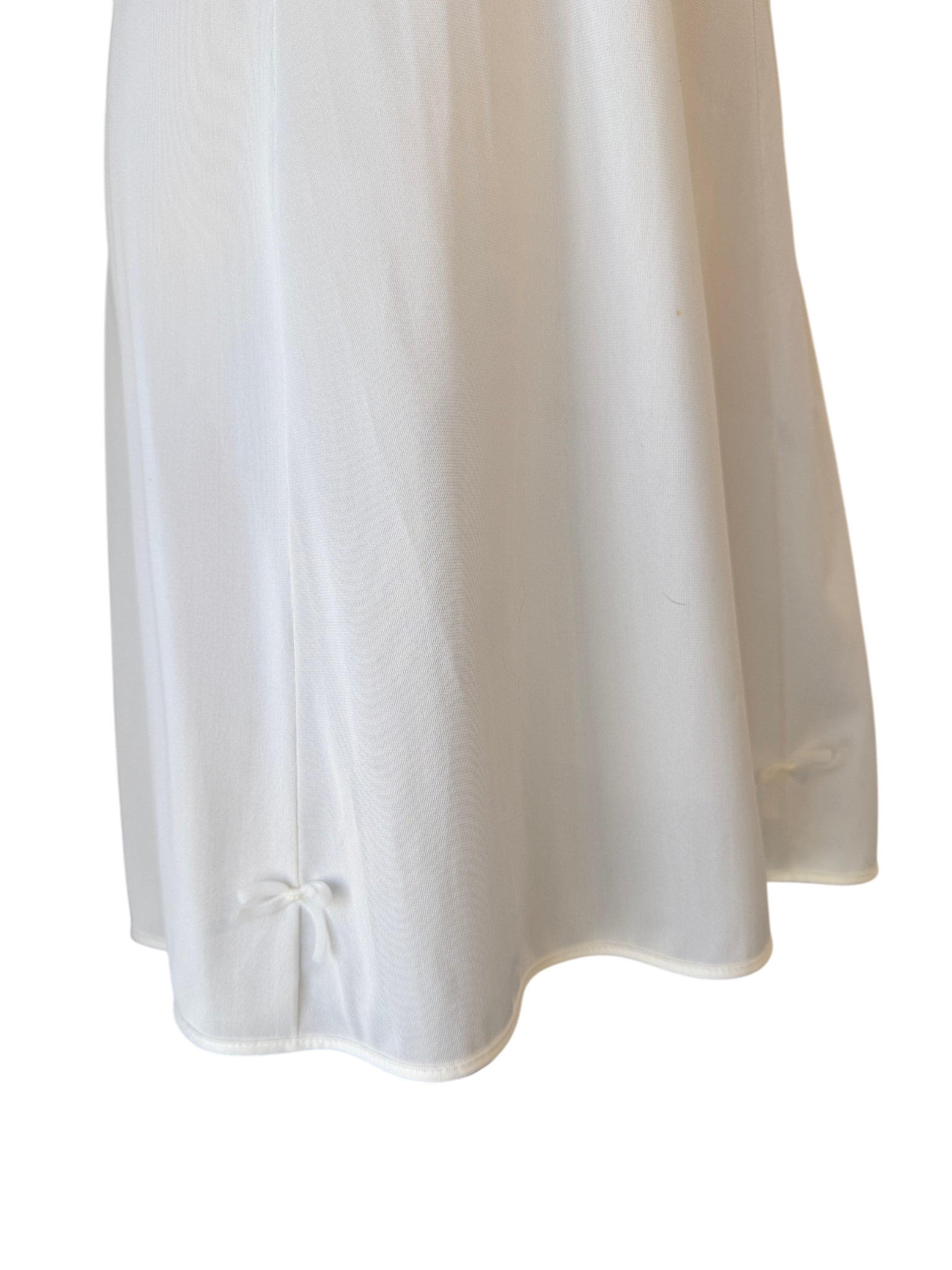 1950s Olga Nylon Ivory slip with key home chest detail and small bow hem details