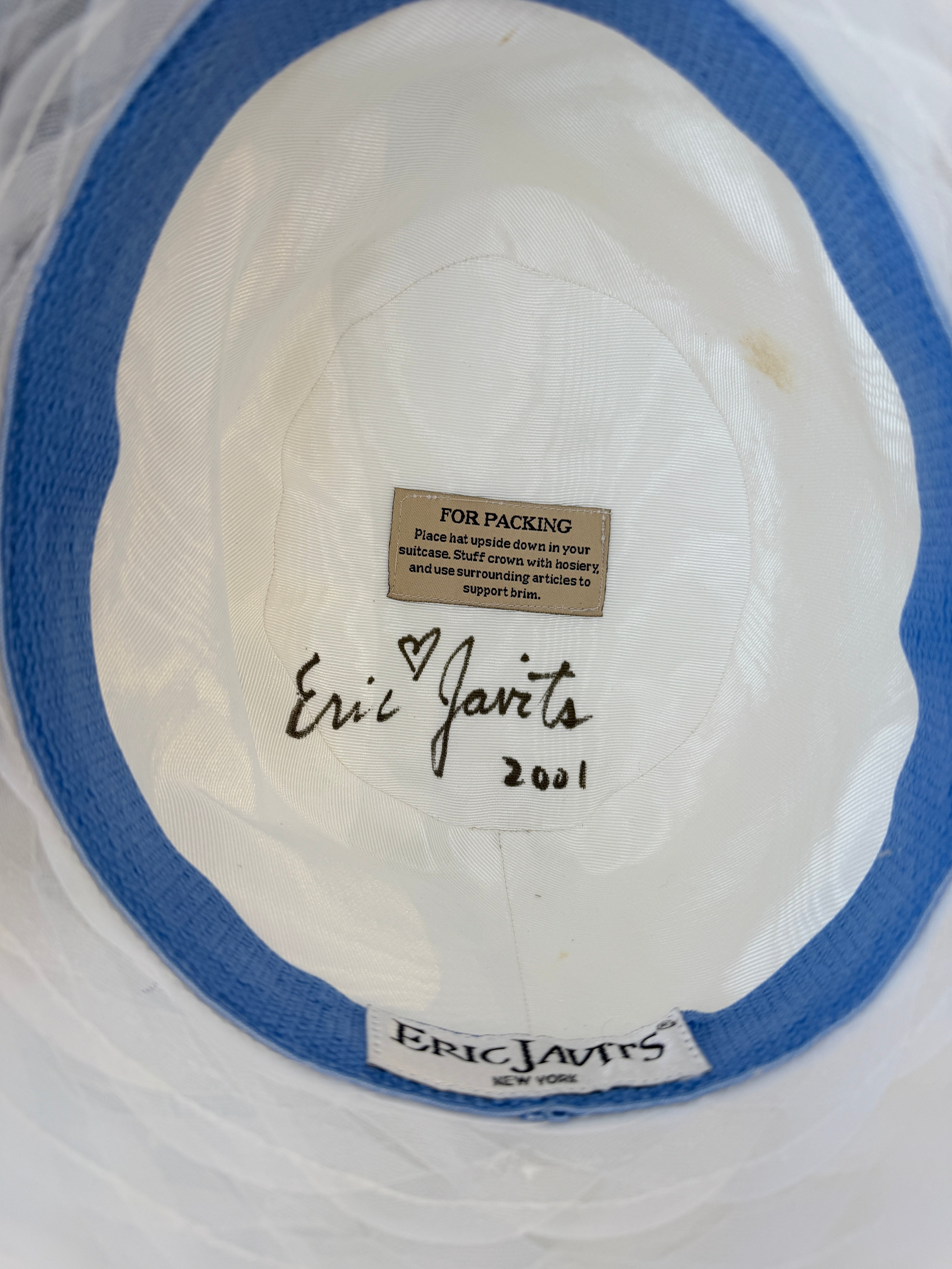 2001 Signed Eric Javits white raffia hat with braided brim and blue/white plaid statment bow with elaborate floral bouquet