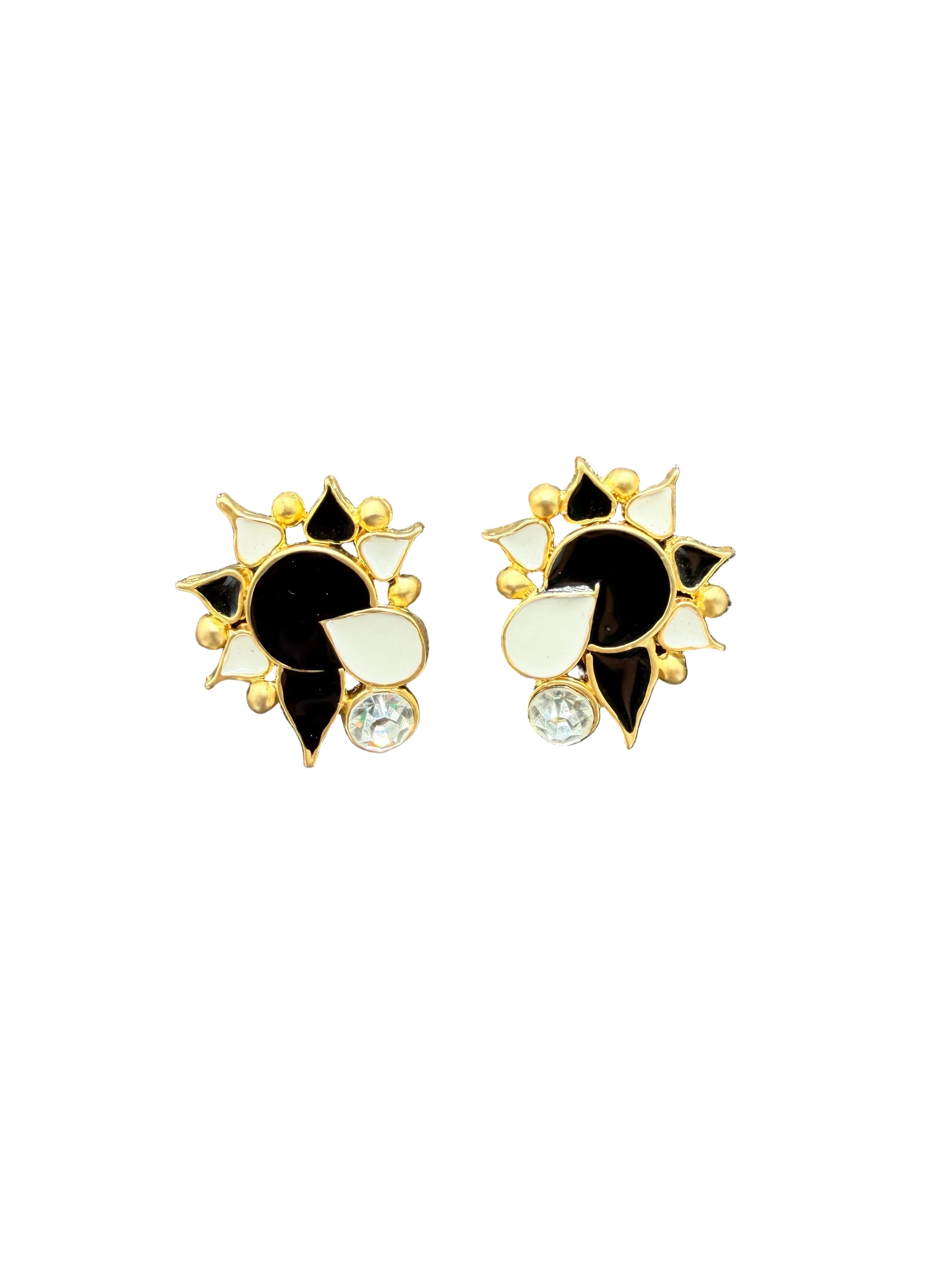 1980s Matte Gold-tone abstract flower clip on earrings with black & white enamel and clear rhinestone accent stone