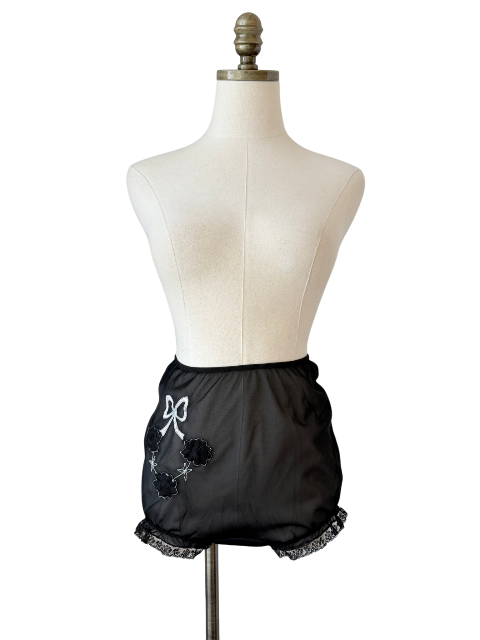 1950s Saks Fifth Avenue black sheer panties with lace ruffle trim and floral & bow appliques