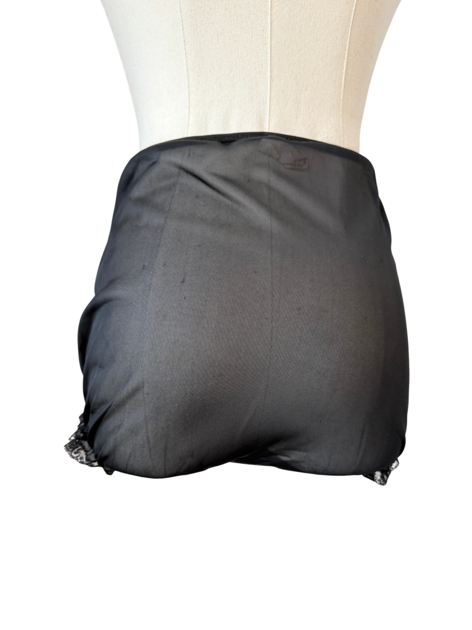 1950s Saks Fifth Avenue black sheer panties with lace ruffle trim and floral & bow appliques