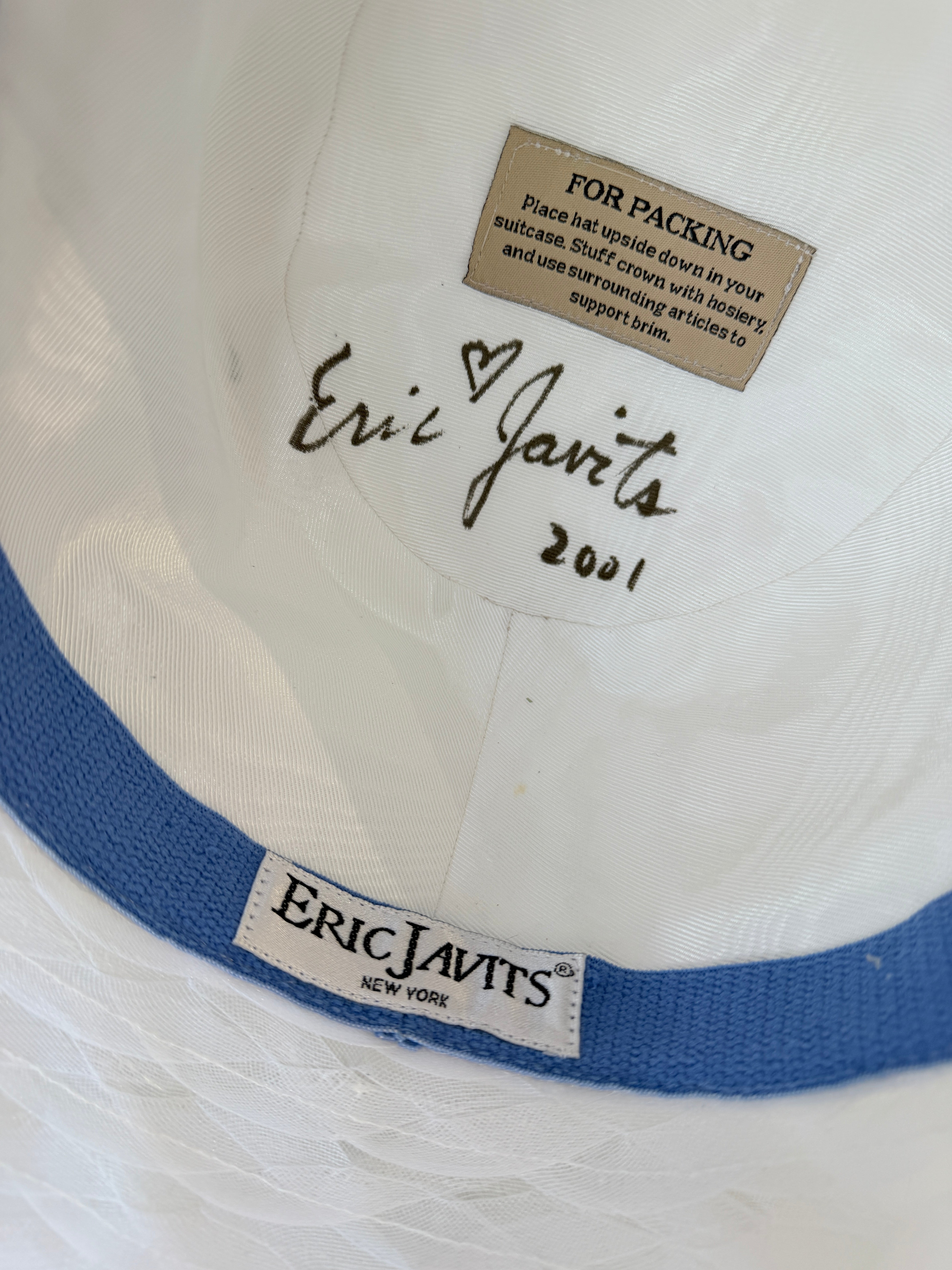 2001 Signed Eric Javits white raffia hat with braided brim and blue/white plaid statment bow with elaborate floral bouquet